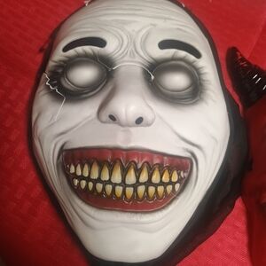 Creepy White Mask with Red and Black Accents